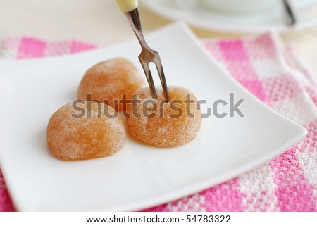 Fork taking sweets on plate. For concepts such as food and beverage, diet and nutrition, and healthy lifestyle.