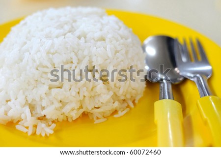 White rice with eating utensils. Rice is the stable diet in most Asian countries. For diet and nutrition, healthy eating and lifestyle concepts.