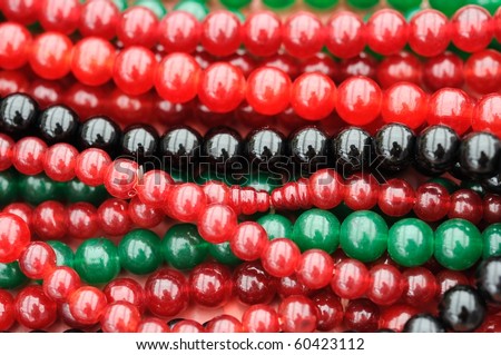 Colored necklace beads for concepts such as religion and buddhism, and jewelry and accessories.