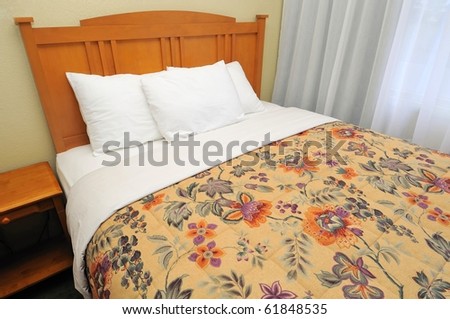 Single western style bed with curtains. Suitable for concepts such as travel, tourism, vacation and holiday, and relaxation.