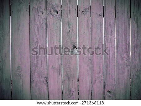 Wooden fence. Wooden fence painted in pink - gray color.