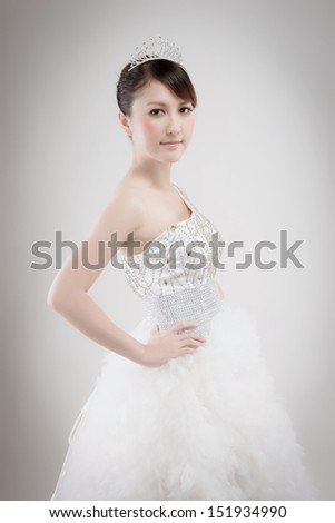Chinese beauty with wedding dress in photo studio