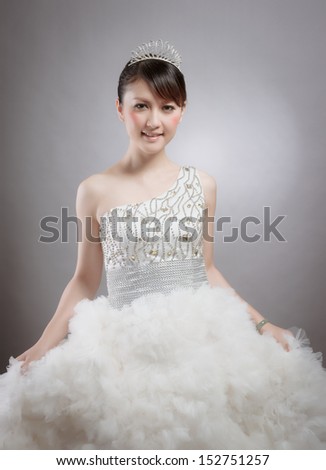 Chinese beauty with wedding dress in photo studio