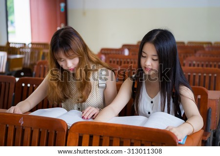 Asian female college students to study in classroom