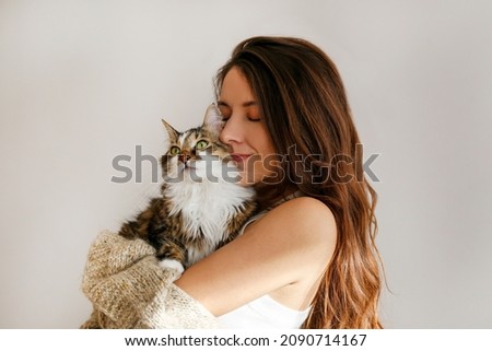 Similar – Image, Stock Photo Young woman in fur coat and lingerie sitting in snowy field