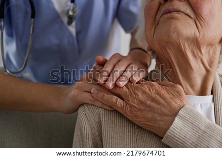 Similar – Image, Stock Photo Unrecognizable person holding medical mask in hand on street in evening
