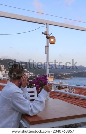 Similar – Image, Stock Photo Unrecognizable female traveler enjoying sunny day on rocky seashore