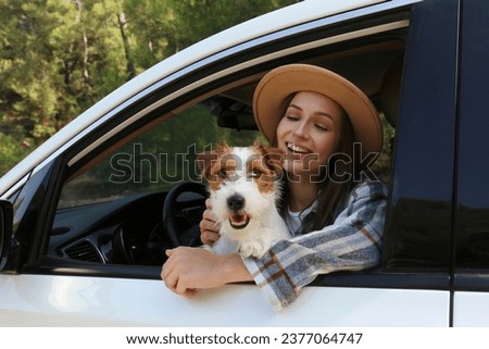 Similar – Image, Stock Photo Young woman with her dog French Bulldog giving him water to refresh after a walk, portrait image. Pet concept. Taking care of the man best friend. Woman taking his dog to a walk during a sunny day