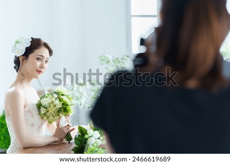 Similar – Image, Stock Photo Woman holding bouquet of fresh flowers against white wall