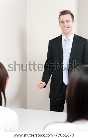 young teacher speaking to asian woman in the meeting room