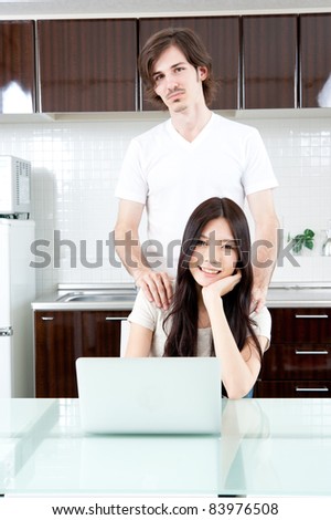 a young couple relaxing in the kitchen