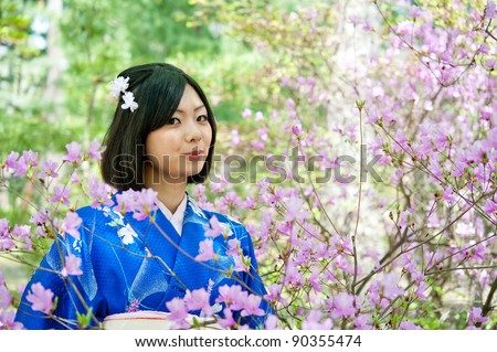 a portrait of japanese kimono woman with cherry blossom