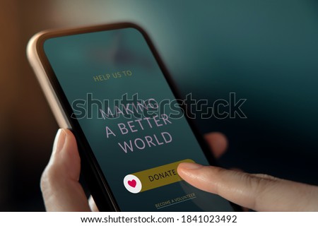 Online Donation, Volunteer and Charity Concept. Woman Making Donate via Internet on Mobile Phone. Closeup Foto d'archivio © 