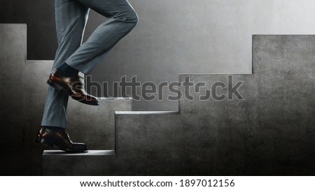 Motion image. Motivation and challenging Concept. Steps Forward into a Success. Low Section of Businessman Walking Up on Staircase. Sureal place