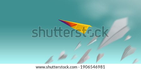 Different, Leader Individuality Concept. Unique Paper Plane Flying Up in the Sky while The Group of Failure is Falling Down. Business Metaphor Photo