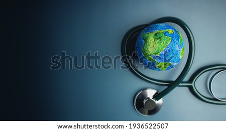 World Health Day. Global Health Awareness Concept. Handmade Globe inside Stethoscope as Heart Shape. Green Environment to Love and Care