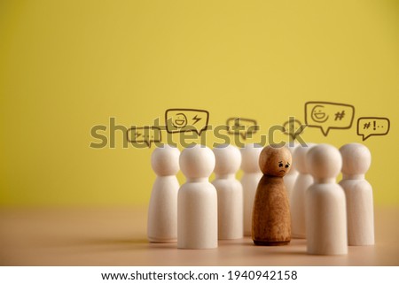 Bullying and Racist Concept. World Social Issue. Sad Person being Bullied from others. Parody and Intimidation. Doing or Saying Bad. presenting by wooden peg dolls Foto stock © 