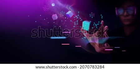 Metaverse and Blockchain Technology Concepts. Person with Glasses try to Touching Object for Experiences of Metaverse Virtual World. Futuristic Tone Foto stock © 