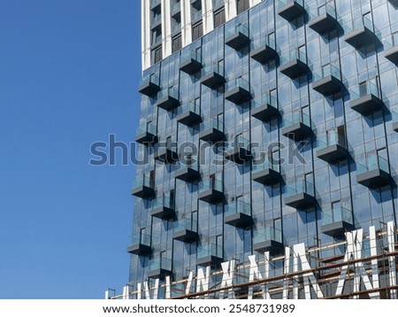 Similar – Image, Stock Photo High-rise building completely scaffolded