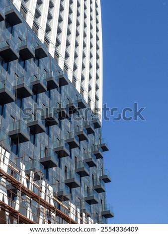 Similar – Image, Stock Photo High-rise building completely scaffolded