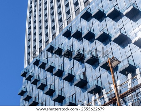 Similar – Image, Stock Photo High-rise building completely scaffolded