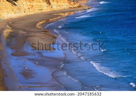 leisure on calm  and beautiful Porto de Mos beach, Lagos, Algarve, Portugal, Europe Stock fotó © 