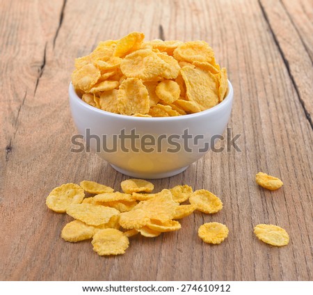 Corn flakes bowl on wood  background