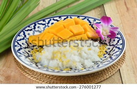 Thai style tropical dessert, sticky rice eat with mangoes