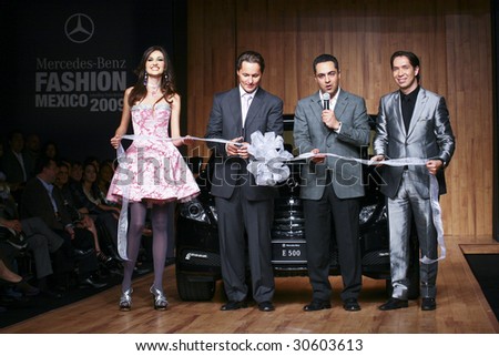 MEXICO CITY-May 18 2009: Model Perla Mercado (L) and Mercedes-Benz Marketing Manager Raul Gonzalez Fillad (3th L-R) attends the Stars Night runaway at Mercedes-Benz Fashion Mexico Autumn/Winter 2009