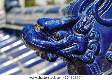 BEIJING - APRIL 7: Ceramic dragon on wall tiles at the Temple of Heaven on April 7, 2012 in Beijing. The Temple of Heaven is one of Beijing\'s main tourist attractions and a World Heritage Site.