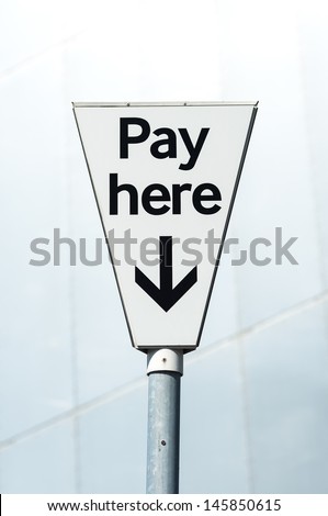 Pay Here sign. Pay and display carpark.