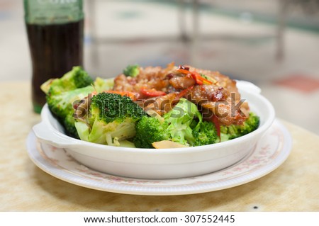 Stir-fried pork and broccoli dish served at a Hong Kong Cooked Food Centre