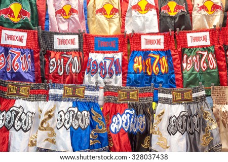BANGKOK, THAILAND - JUNE 14, 2015 - Thai boxing shorts on sale at Patpong night market on June 14, 2015 in Bangkok. Thai boxing, also known as muay Thai, is the national sport of Thailand.