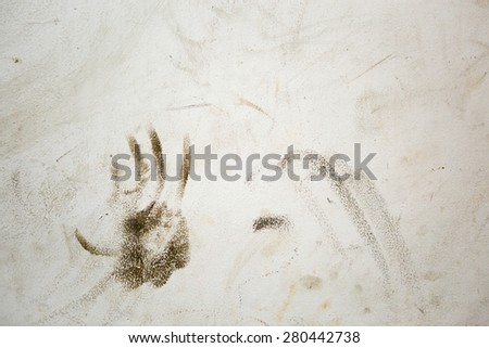 Abstract hand print on concrete wall