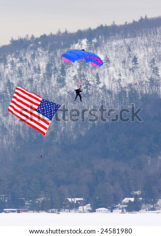 LAKE GEORGE, NY - February 7, 2009: A parachutist coming in for a landing at the start of the February 7 , 2009 Lake George Winter Carnival.