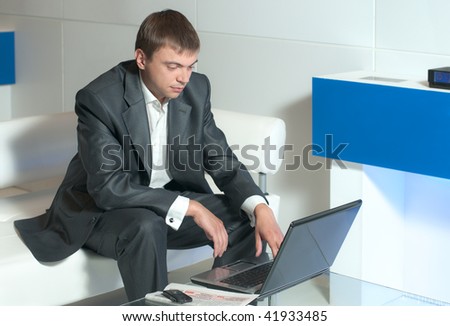 a young businessman conducts business correspondence in the office
