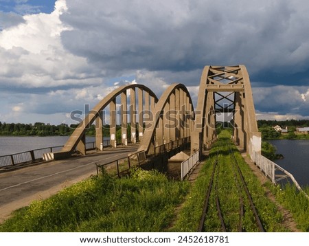 Similar – Image, Stock Photo Old bridge over river against town in mountainous area