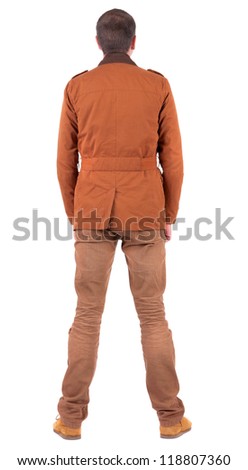 Back view of stylishly dressed man in a brown jackett  looking up.   Standing young guy in jeans and  jacket. Rear view people collection.  backside view of person.  Isolated over white background.