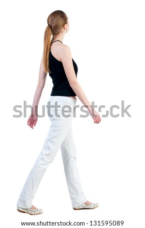 back view of walking  woman in  in white trousers and shirt. beautiful blonde girl in motion.  backside view of person.  Rear view people collection. Isolated over white background.