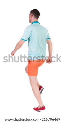 Back view of running sportsman. Man in blue t-shirt and orange shorts.  Walking guy in motion. Rear view people collection. Backside view of person. Isolated over white background.