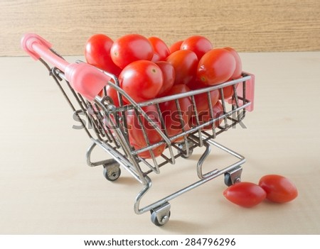 Vegetable, A Small Shopping Cart Full with Fresh Red Grape Tomatoes or Cherry Tomatoes.