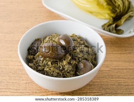 Chinese Traditional Food, Chopped Pickled Chinese Cabbage with Chinese Olives in A Bowl.