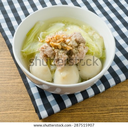 Thai Cuisine and Food, A Bowl of Chinese Lettuce with Minced Pork and Fish Meat Ball Soup Topping with Fried Garlic.