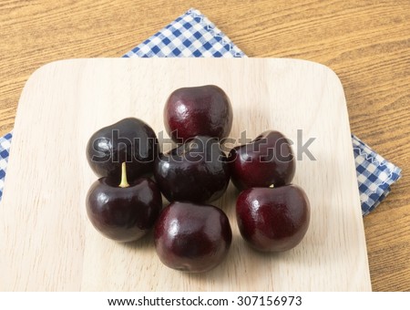 Fresh Fruits, Stack of Ripe and Sweet Red Plums A Very Good Source of Vitamin C on A Wooden Cutting Board.