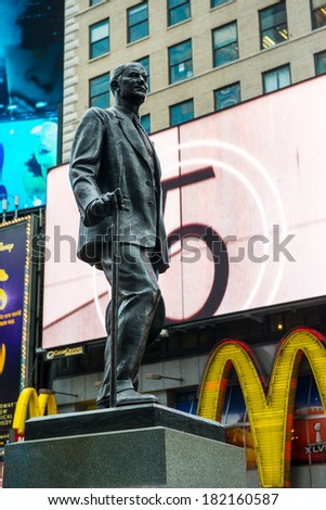 NYC, NEW YORK Ã¢Â?Â? CIRCA FEBRUARY 2014: A statue in front of digital signage in Times Square.