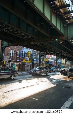 NYC, NEW YORK Ã¢Â?Â? CIRCA FEBRUARY 2014: Street traffic drives underneath a metro rail line on Roosevelt Street.