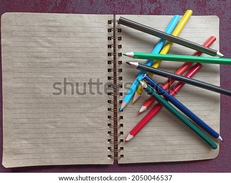 notebook and the colourfull pencils Stok fotoğraf © 