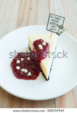 white chocolate cheesecake and raspberry sauce