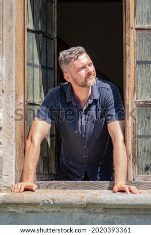 Similar – Image, Stock Photo Man leaning on wooden door