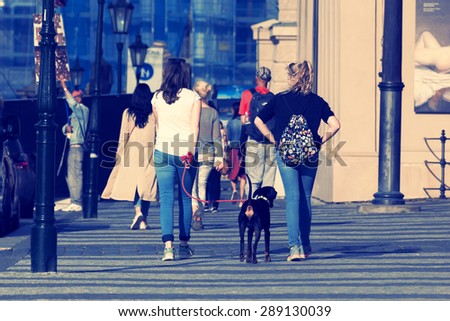 PRAGUE, CZECH REPUBLIC - JUNE 17 2015: Two unknown girls walking the street